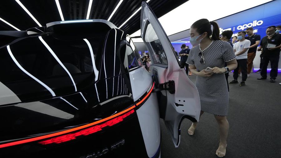This picture taken on July 20, 2022 shows Baidu's Apollo RT6 next-generation autonomous vehicle during its unveiling in Beijing. - The Apollo RT6 is designed for fully autonomous driving with detachable steering wheel, and is set to join the Apollo Go ride-hailing service starting in 2023. (Photo by Noel Celis / AFP) (Photo by NOEL CELIS/AFP via Getty Images)