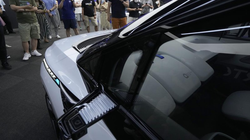 This picture taken on July 20, 2022 shows Baidu's Apollo RT6 next-generation autonomous vehicle during its unveiling in Beijing. - The Apollo RT6 is designed for fully autonomous driving with detachable steering wheel, and is set to join the Apollo Go ride-hailing service starting in 2023. (Photo by Noel Celis / AFP) (Photo by NOEL CELIS/AFP via Getty Images)