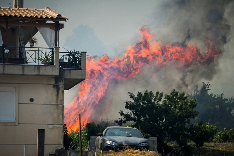 Kebakaran hutan berkobar dekat resor Vatera di Lesbos, Yunani (REUTERS/EUROKINISSI) Kebakaran hutan berkobar dekat resor Vatera di Lesbos, Yunani (REUTERS/EUROKINISSI)