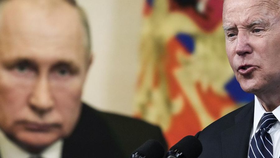 WASHINGTON, DC - JUNE 22: An image of Russian President Vladimir Putin is displayed as U.S. President Joe Biden speaks about gas prices in the South Court Auditorium at the White House campus on June 22, 2022 in Washington, DC. Biden called on Congress to temporarily suspend the federal gas tax. (Photo by Drew Angerer/Getty Images)