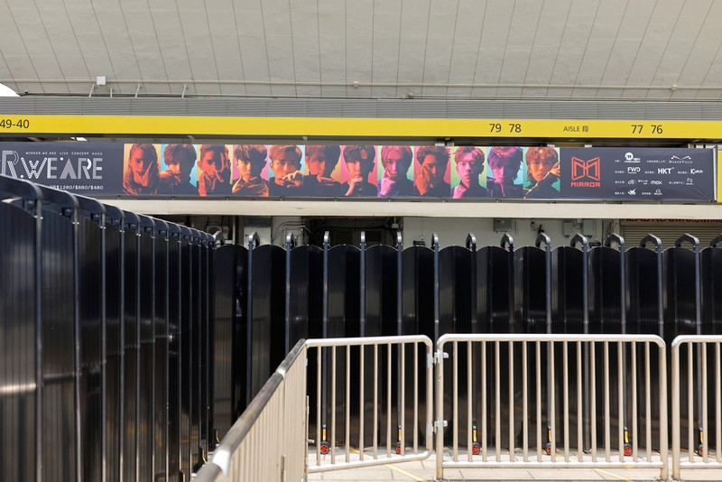 In this image made from video taken from social media, a video screen suspended above the stage falls onto the stage where dancers perform at a concert of Cantopop boy band Mirror in Hong Kong, Thursday, July 28, 2022. Hong Kong officials say they will open an investigation into the concert accident in which the giant video screen fell down onto the stage and injured two dancers. (AP Photo)