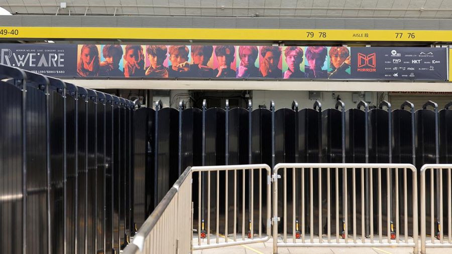 In this image made from video taken from social media, a video screen suspended above the stage falls onto the stage where dancers perform at a concert of Cantopop boy band Mirror in Hong Kong, Thursday, July 28, 2022. Hong Kong officials say they will open an investigation into the concert accident in which the giant video screen fell down onto the stage and injured two dancers. (AP Photo)