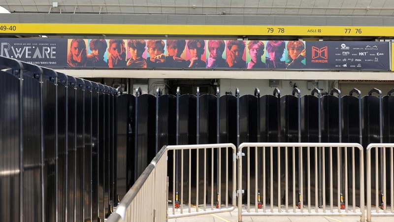 In this image made from video taken from social media, a video screen suspended above the stage falls onto the stage where dancers perform at a concert of Cantopop boy band Mirror in Hong Kong, Thursday, July 28, 2022. Hong Kong officials say they will open an investigation into the concert accident in which the giant video screen fell down onto the stage and injured two dancers. (AP Photo)