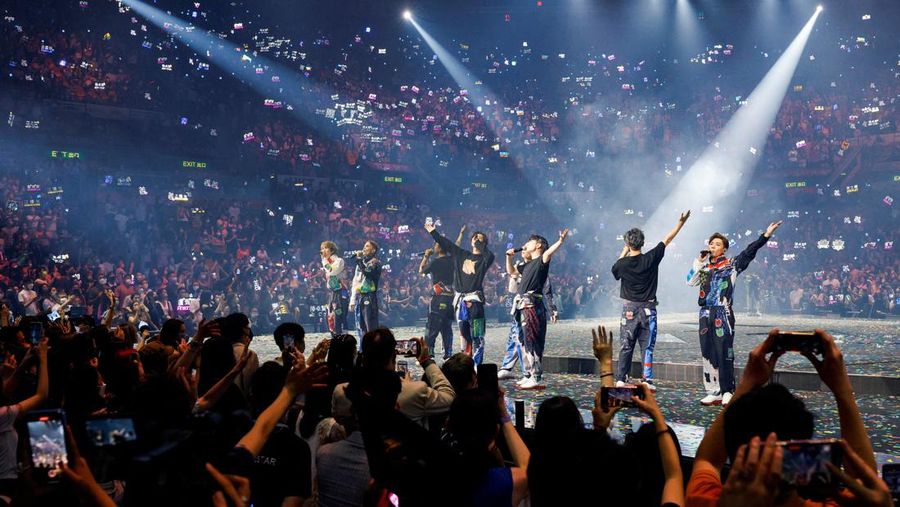 In this image made from video taken from social media, a video screen suspended above the stage falls onto the stage where dancers perform at a concert of Cantopop boy band Mirror in Hong Kong, Thursday, July 28, 2022. Hong Kong officials say they will open an investigation into the concert accident in which the giant video screen fell down onto the stage and injured two dancers. (AP Photo)