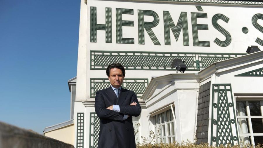 Frenxh luxury group Hermes Executive Chairman Axel Dumas poses on the roof of the the Hermes Faubourg Saint-Honore store in Paris on March 20, 2014, the of day the group's 2013 results presentation. Hermes announced a 6,8 percent increase in benefits at 790 million euros for 2013. (Photo by Eric PIERMONT / AFP) (Photo by ERIC PIERMONT/AFP via Getty Images)