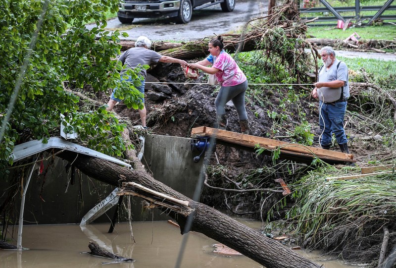 A flooded area is flown over by a Kentucky National Guard helicopter deployed in response to a declared state of emergency in eastern Kentucky, U.S. July 27, 2022. U.S. Army National Guard/Handout via REUTERS  THIS IMAGE HAS BEEN SUPPLIED BY A THIRD PARTY.