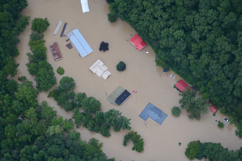 A flooded area is flown over by a Kentucky National Guard helicopter deployed in response to a declared state of emergency in eastern Kentucky, U.S. July 27, 2022. U.S. Army National Guard/Handout via REUTERS  THIS IMAGE HAS BEEN SUPPLIED BY A THIRD PARTY.
