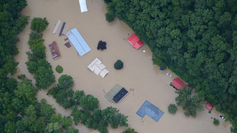A flooded area is flown over by a Kentucky National Guard helicopter deployed in response to a declared state of emergency in eastern Kentucky, U.S. July 27, 2022. U.S. Army National Guard/Handout via REUTERS  THIS IMAGE HAS BEEN SUPPLIED BY A THIRD PARTY.