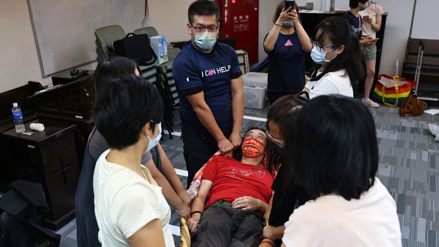 Military police officers get into position for a drill on how to guide citizens to safety in the event of an attack, in Taipei, Taiwan July 22, 2022. REUTERS/Ann Wang