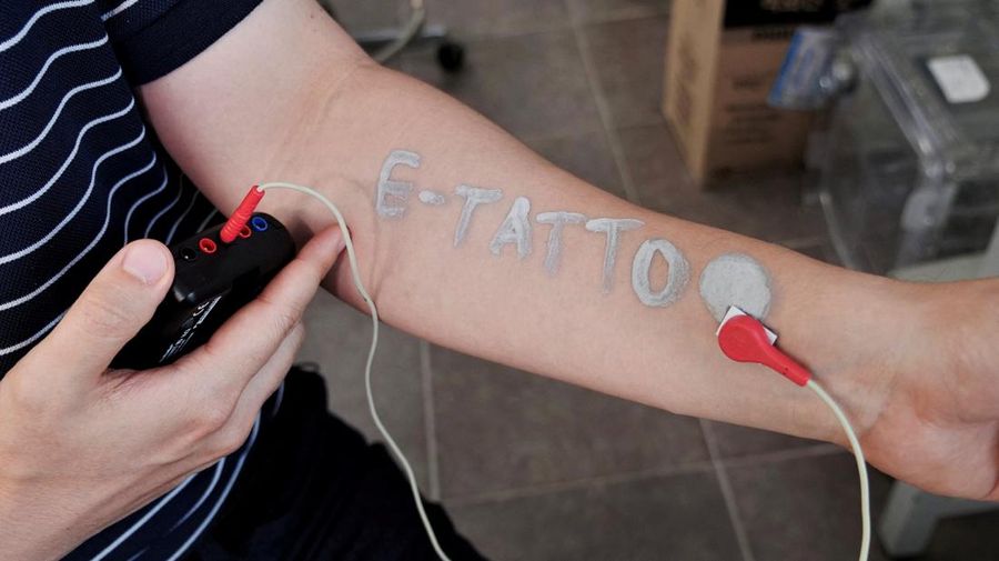 Steve Park, Materials Science & Engineering professor at Korea Advanced Institute of Science and Technology (KAIST), demonstrates an electronic tattoo (e-tattoo) on his arm connected with an electrocardiogram (ECG) monitoring system in Daejeon, South Korea, July 26, 2022.   REUTERS/Minwoo Park