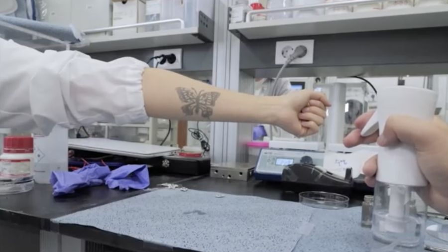 Steve Park, Materials Science & Engineering professor at Korea Advanced Institute of Science and Technology (KAIST), demonstrates an electronic tattoo (e-tattoo) on his arm connected with an electrocardiogram (ECG) monitoring system in Daejeon, South Korea, July 26, 2022.   REUTERS/Minwoo Park