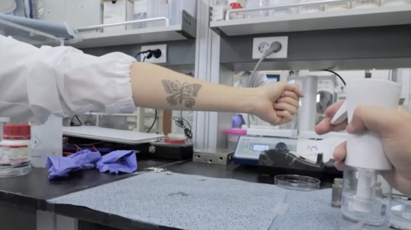 Steve Park, Materials Science & Engineering professor at Korea Advanced Institute of Science and Technology (KAIST), demonstrates an electronic tattoo (e-tattoo) on his arm connected with an electrocardiogram (ECG) monitoring system in Daejeon, South Korea, July 26, 2022.   REUTERS/Minwoo Park