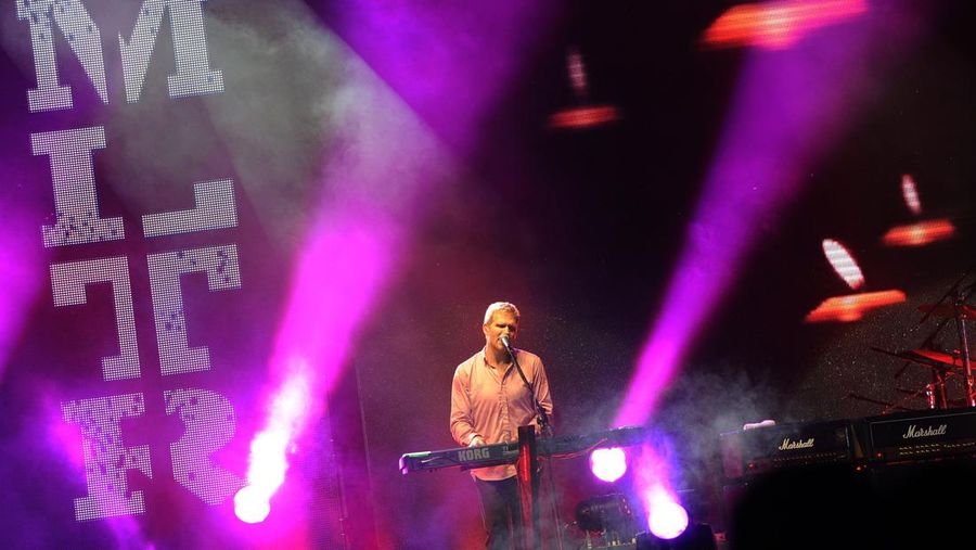This picture taken late on March 31, 2013 shows lead vocalist of Danish rock band Michael Learns To Rock (MLTR) Jascha Richter performing during their concert in Yangon. AFP PHOTO / Soe Than WIN (Photo credit should read Soe Than WIN/AFP via Getty Images)