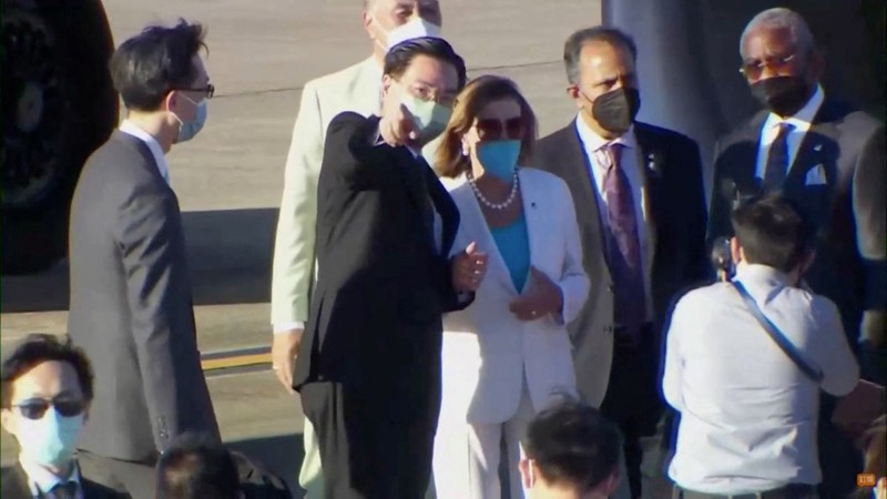 ASIA-PELOSI/ U.S. House of Representatives Speaker Nancy Pelosi waves with other members of the delegation as they board a plane before leaving Taipei Songshan Airport, in Taipei, Taiwan August 3, 2022, in this screengrab taken from video. REUTERS TV/Pool via REUTERS. NO RESALES. NO ARCHIVES.