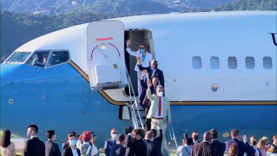 U.S. House of Representatives Speaker Nancy Pelosi waves with other members of the delegation as they board a plane before leaving Taipei Songshan Airport, in Taipei, Taiwan August 3, 2022, in this screengrab taken from video. REUTERS TV/Pool via REUTERS. NO RESALES. NO ARCHIVES.