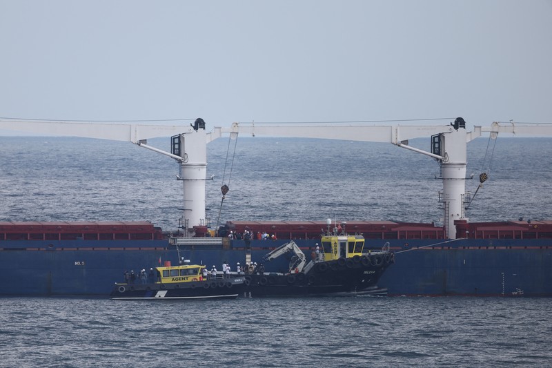 UKRAINE-CRISIS/GRAIN-TURKEY-OFFICIALS The Joint Coordination Centre officials board Sierra Leone-flagged cargo ship Razoni, carrying Ukrainian grain, for an inspection in the Black Sea off Kilyos, near Istanbul, Turkey August 3, 2022. REUTERS/Umit Bektas
