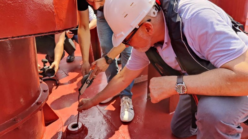 The Joint Coordination Centre officials board Sierra Leone-flagged cargo ship Razoni, carrying Ukrainian grain, for an inspection in the Black Sea off Kilyos, near Istanbul, Turkey August 3, 2022. REUTERS/Umit Bektas