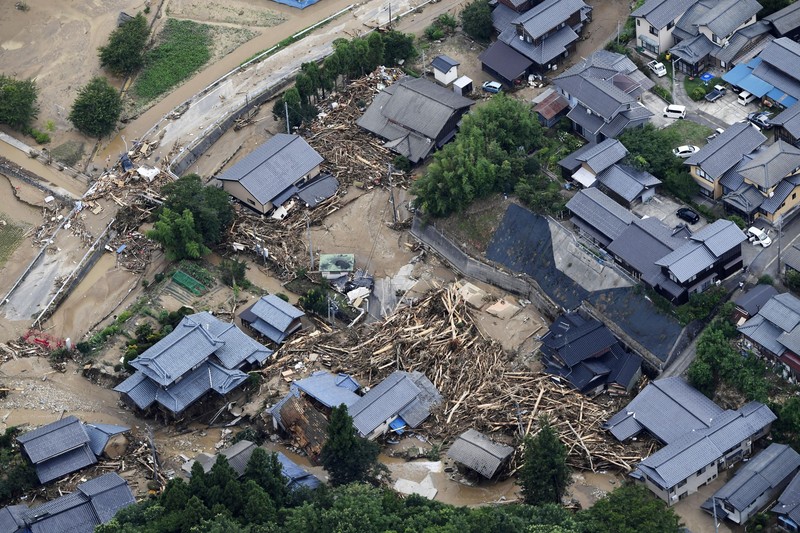 An aerial view shows debris and destroyed houses, caused by a flash flood due to heavy rains, in Murakami, Niigata prefecture, Japan August 4, 2022, in this photo taken by Kyodo. Mandatory credit Kyodo via REUTERS ATTENTION EDITORS - THIS IMAGE WAS PROVIDED BY A THIRD PARTY. MANDATORY CREDIT. JAPAN OUT. NO COMMERCIAL OR EDITORIAL SALES IN JAPAN