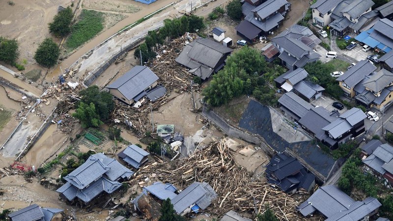 An aerial view shows debris and destroyed houses, caused by a flash flood due to heavy rains, in Murakami, Niigata prefecture, Japan August 4, 2022, in this photo taken by Kyodo. Mandatory credit Kyodo via REUTERS ATTENTION EDITORS - THIS IMAGE WAS PROVIDED BY A THIRD PARTY. MANDATORY CREDIT. JAPAN OUT. NO COMMERCIAL OR EDITORIAL SALES IN JAPAN