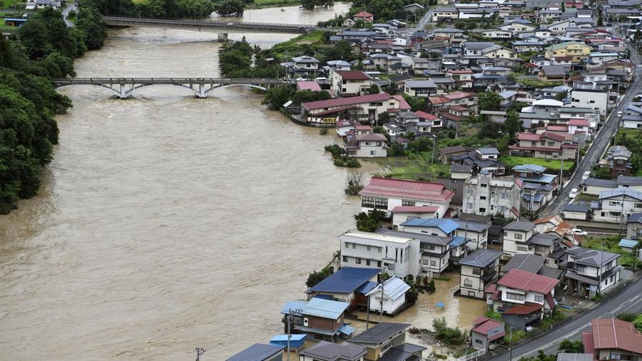 An aerial view shows debris and destroyed houses, caused by a flash flood due to heavy rains, in Murakami, Niigata prefecture, Japan August 4, 2022, in this photo taken by Kyodo. Mandatory credit Kyodo via REUTERS ATTENTION EDITORS - THIS IMAGE WAS PROVIDED BY A THIRD PARTY. MANDATORY CREDIT. JAPAN OUT. NO COMMERCIAL OR EDITORIAL SALES IN JAPAN