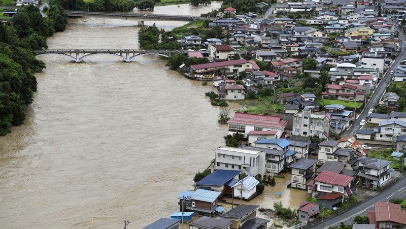 An aerial view shows debris and destroyed houses, caused by a flash flood due to heavy rains, in Murakami, Niigata prefecture, Japan August 4, 2022, in this photo taken by Kyodo. Mandatory credit Kyodo via REUTERS ATTENTION EDITORS - THIS IMAGE WAS PROVIDED BY A THIRD PARTY. MANDATORY CREDIT. JAPAN OUT. NO COMMERCIAL OR EDITORIAL SALES IN JAPAN