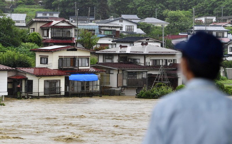 WEATHER-JAPAN/RAIN An aerial view shows debris and destroyed houses, caused by a flash flood due to heavy rains, in Murakami, Niigata prefecture, Japan August 4, 2022, in this photo taken by Kyodo. Mandatory credit Kyodo via REUTERS ATTENTION EDITORS - THIS IMAGE WAS PROVIDED BY A THIRD PARTY. MANDATORY CREDIT. JAPAN OUT. NO COMMERCIAL OR EDITORIAL SALES IN JAPAN