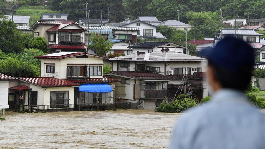 An aerial view shows debris and destroyed houses, caused by a flash flood due to heavy rains, in Murakami, Niigata prefecture, Japan August 4, 2022, in this photo taken by Kyodo. Mandatory credit Kyodo via REUTERS ATTENTION EDITORS - THIS IMAGE WAS PROVIDED BY A THIRD PARTY. MANDATORY CREDIT. JAPAN OUT. NO COMMERCIAL OR EDITORIAL SALES IN JAPAN