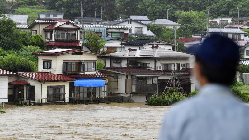 An aerial view shows debris and destroyed houses, caused by a flash flood due to heavy rains, in Murakami, Niigata prefecture, Japan August 4, 2022, in this photo taken by Kyodo. Mandatory credit Kyodo via REUTERS ATTENTION EDITORS - THIS IMAGE WAS PROVIDED BY A THIRD PARTY. MANDATORY CREDIT. JAPAN OUT. NO COMMERCIAL OR EDITORIAL SALES IN JAPAN