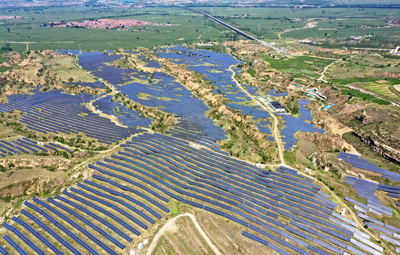 ZHANGJIAKOU, CHINA - AUGUST 6, 2022 - An aerial photo shows a photovoltaic power station on barren mountain in Zhangjiakou, Hebei province, Aug 6, 2022. (Photo credit should read CFOTO/Future Publishing via Getty Images)