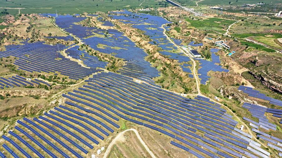 ZHANGJIAKOU, CHINA - AUGUST 6, 2022 - An aerial photo shows a photovoltaic power station on barren mountain in Zhangjiakou, Hebei province, Aug 6, 2022. (Photo credit should read CFOTO/Future Publishing via Getty Images)