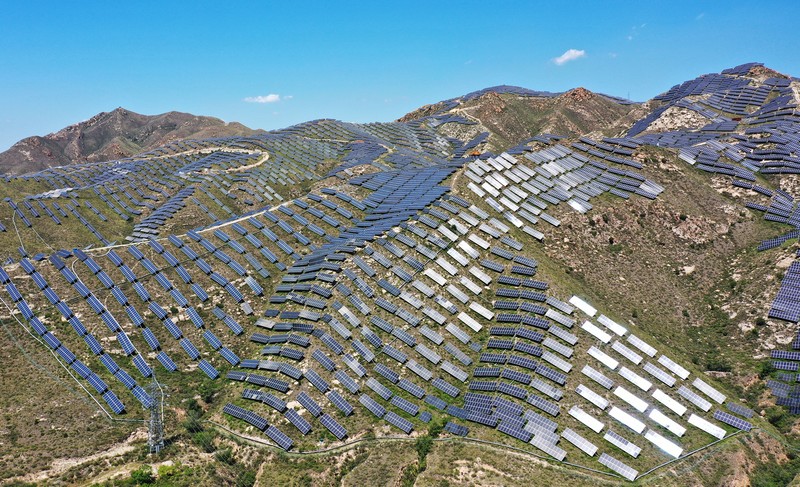 ZHANGJIAKOU, CHINA - AUGUST 6, 2022 - An aerial photo shows a photovoltaic power station on barren mountain in Zhangjiakou, Hebei province, Aug 6, 2022. (Photo credit should read CFOTO/Future Publishing via Getty Images)