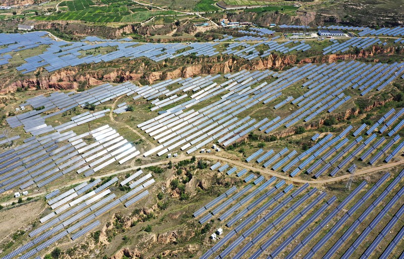 ZHANGJIAKOU, CHINA - AUGUST 6, 2022 - An aerial photo shows a photovoltaic power station on barren mountain in Zhangjiakou, Hebei province, Aug 6, 2022. (Photo credit should read CFOTO/Future Publishing via Getty Images)