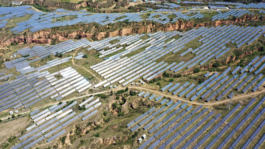 ZHANGJIAKOU, CHINA - AUGUST 6, 2022 - An aerial photo shows a photovoltaic power station on barren mountain in Zhangjiakou, Hebei province, Aug 6, 2022. (Photo credit should read CFOTO/Future Publishing via Getty Images)