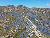 ZHANGJIAKOU, CHINA - AUGUST 6, 2022 - An aerial photo shows a photovoltaic power station on barren mountain in Zhangjiakou, Hebei province, Aug 6, 2022. (Photo credit should read CFOTO/Future Publishing via Getty Images)