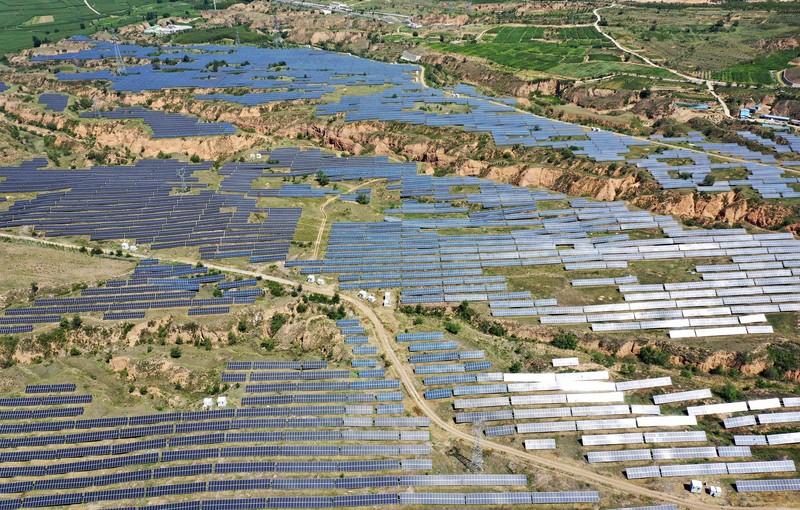 ZHANGJIAKOU, CHINA - AUGUST 6, 2022 - An aerial photo shows a photovoltaic power station on barren mountain in Zhangjiakou, Hebei province, Aug 6, 2022. (Photo credit should read CFOTO/Future Publishing via Getty Images)