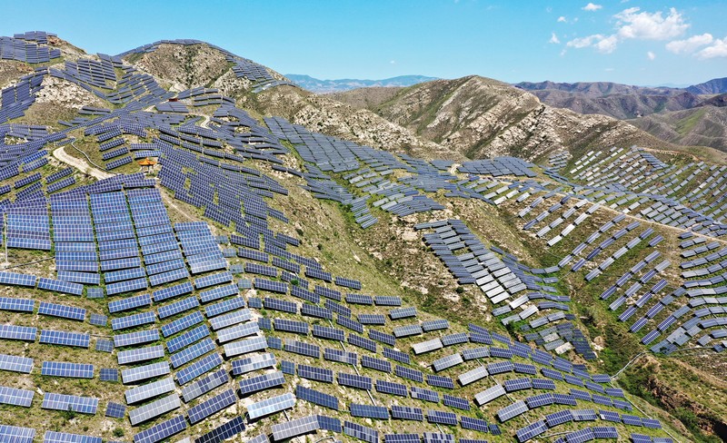 ZHANGJIAKOU, CHINA - AUGUST 6, 2022 - An aerial photo shows a photovoltaic power station on barren mountain in Zhangjiakou, Hebei province, Aug 6, 2022. (Photo credit should read CFOTO/Future Publishing via Getty Images)