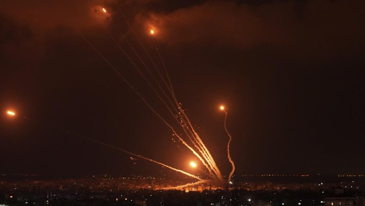 Rockets are seen in the sky fired by Palestinian militants toward Israel, in Gaza, Friday, Aug. 5, 2022. Palestinian officials say Israeli airstrikes on Gaza have killed at least 10 people, including a senior militant, and wounded 55 others. (AP Photo/Adel Hana)