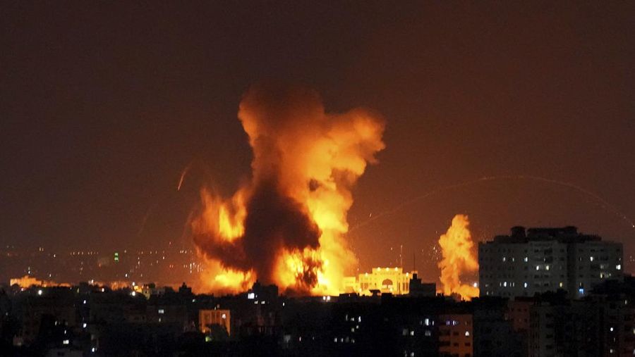 Smoke rises following Israeli airstrikes on a building in Gaza City,  Friday, Aug. 5, 2022. Palestinian officials say Israeli airstrikes on Gaza have killed several people, including a senior militant, and wounded 40 others. (AP Photo/Hatem Moussa)
