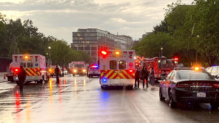 A lightning strike hits a tree in Lafayette Park across from the White House, killing two people and injuring two others below, during an August 4 evening thunderstom as seen in this framegrab from a Reuters TV video camera mounted on a nearby rooftop in Washington, U.S. August 4, 2022.   REUTERS/REUTERS TV