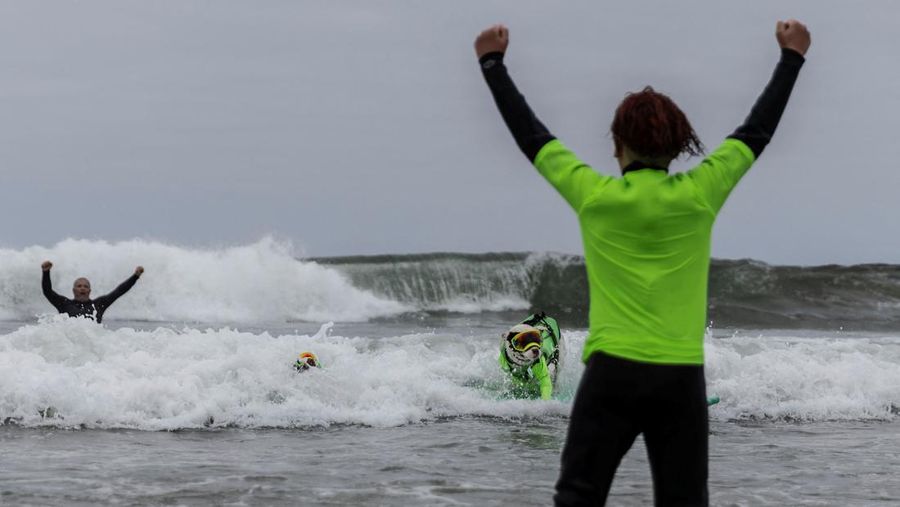 Rosie competes at the World Dog Surfing Championships in Pacifica, California, U.S., August 6, 2022. REUTERS/Carlos Barria     TPX IMAGES OF THE DAY