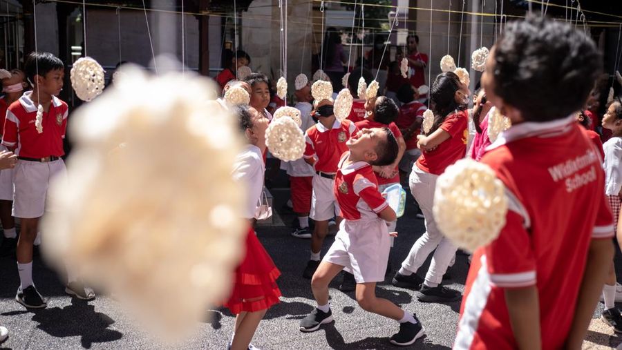 Children take part in games held to celebrate the 77th Independence Day of the Republic of Indonesia, in Surabaya on August 17, 2022. (Photo by JUNI KRISWANTO / AFP) (Photo by JUNI KRISWANTO/AFP via Getty Images)