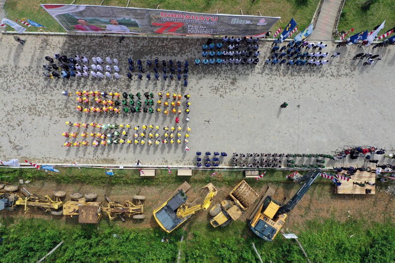 An aerial picture shows a flag-raising ceremony at ground zero of Indonesia's future capital in Sepaku, Penajam Paser Utara, East Kalimantan on August 17, 2022, on the country's 77th Independence Day. (Photo by ADEK BERRY / AFP) (Photo by ADEK BERRY/AFP via Getty Images)
