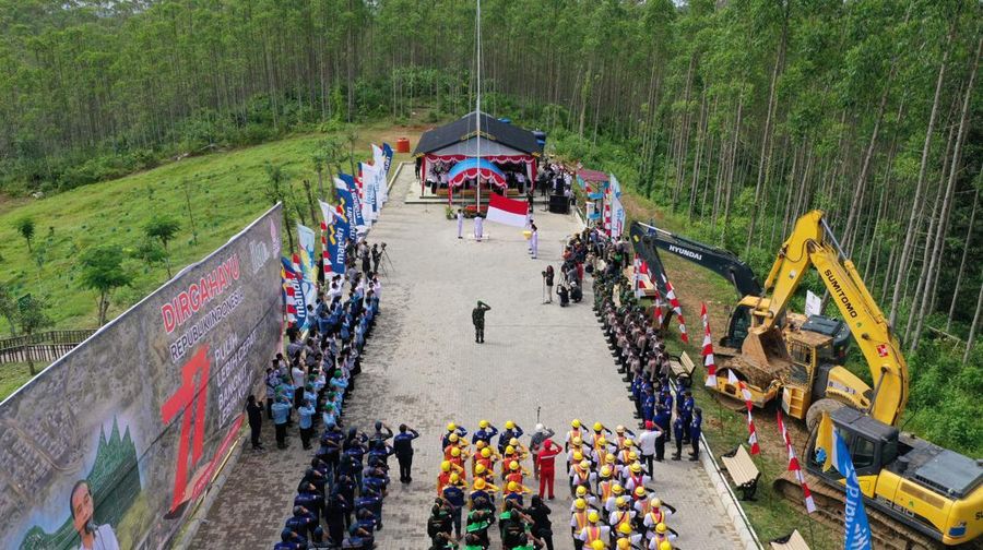 An aerial picture shows a flag-raising ceremony at ground zero of Indonesia's future capital in Sepaku, Penajam Paser Utara, East Kalimantan on August 17, 2022, on the country's 77th Independence Day. (Photo by ADEK BERRY / AFP) (Photo by ADEK BERRY/AFP via Getty Images)