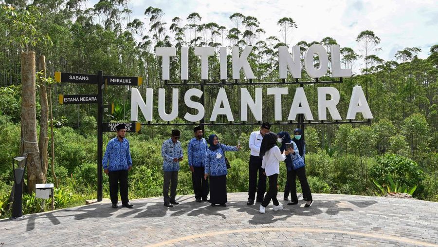 Attendees stand by a lookout point where a flag-raising ceremony was held at ground zero of Indonesia's future capital in Sepaku, Penajam Paser Utara, East Kalimantan on August 17, 2022, on the country's 77th Independence Day. (Photo by ADEK BERRY / AFP) (Photo by ADEK BERRY/AFP via Getty Images)