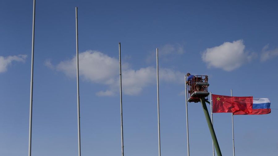 MOSCOW REGION, ZHUKOVSKY, RUSSIA - 2019/08/24: National flags of Russia and China being mounted three days prior the official opening of the MAKS-2019 Moscow International Airshow near Zhukovsky, South-East of Moscow. (Photo by Leonid Faerberg/SOPA Images/LightRocket via Getty Images)