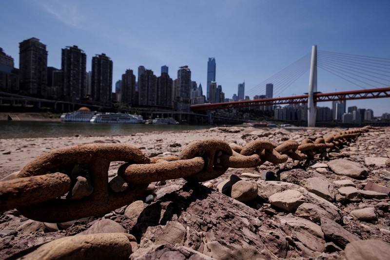 The central pillar of Qiansimen bridge stands exposed on the dried-up riverbed of the Jialing river, a tributary of the Yangtze, that is approaching record-low water levels in Chongqing, China, August 18, 2022.   REUTERS/Thomas Peter