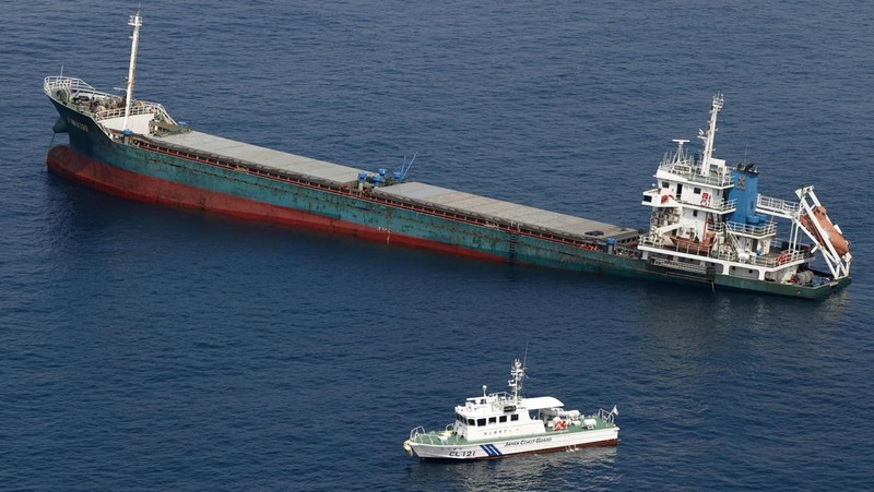 This aerial photo shows Belize-registered cargo ship Xin Hai 99, after a collision, off Kushimoto, Wakayama prefecture, southwestern Japan, Saturday, Aug. 20, 2022. A Japanese chemical tanker ship crashed into the cargo ship off the coast of southwestern Japan, the coast guard said Saturday.(Kyodo News via AP)