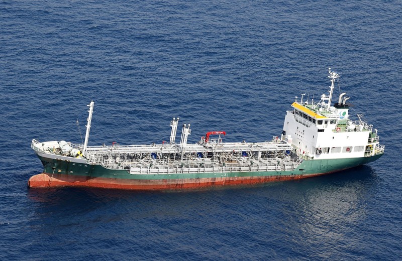 Japan Ship Collision This aerial photo shows Belize-registered cargo ship Xin Hai 99, after a collision, off Kushimoto, Wakayama prefecture, southwestern Japan, Saturday, Aug. 20, 2022. A Japanese chemical tanker ship crashed into the cargo ship off the coast of southwestern Japan, the coast guard said Saturday.(Kyodo News via AP)