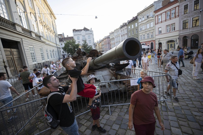 LVIV, UKRAINE - AUGUST 20: People visit the Russian equipment destroyed by the Armed Forces of Ukraine at the Market Square as the Russia-Ukraine war continues especially in Donetsk region in the east, in Lviv Oblast, Ukraine on August 20, 2022. (Photo by Metin Aktas/Anadolu Agency via Getty Images)