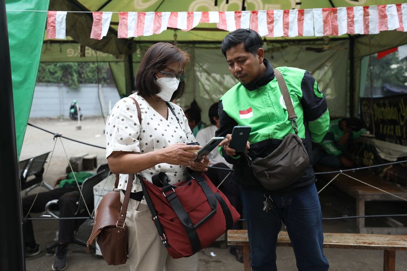 Ilustrasi aturan baru tarif ojek online. (CNBC Indonesia/Tri Susilo)